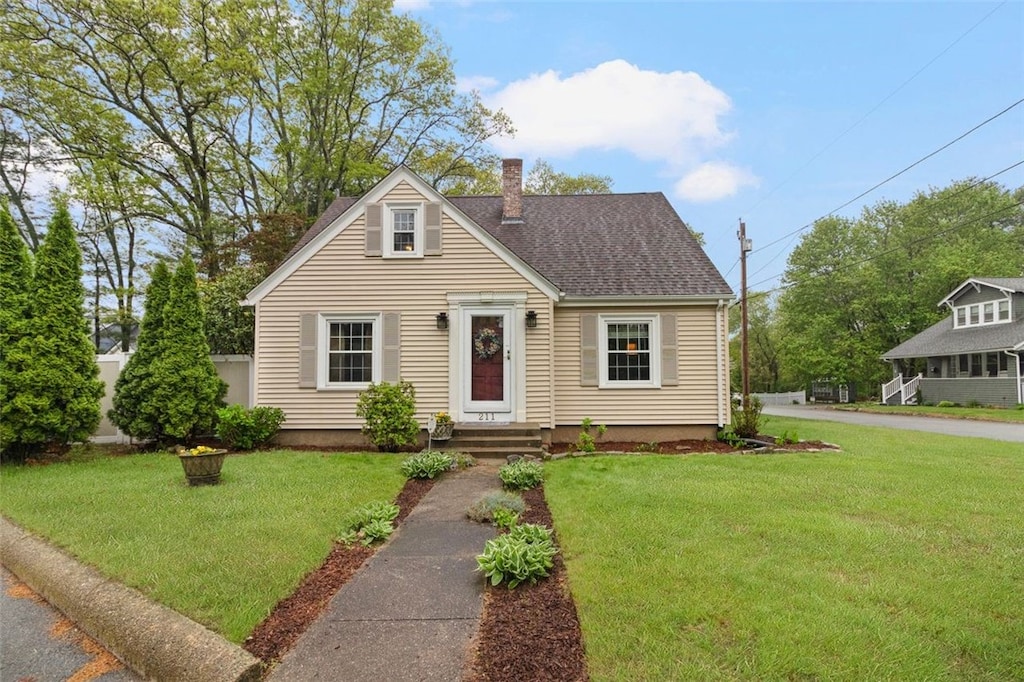 211 Fairview Ave, Coventry, RI 02816 - view of front of property with a chimney, a front lawn, and a shingled roof