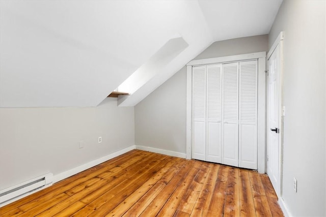 366 Pascoag Main St, Burrillville, RI 02859 - additional living space featuring a baseboard radiator, vaulted ceiling, wood-type flooring, and baseboards