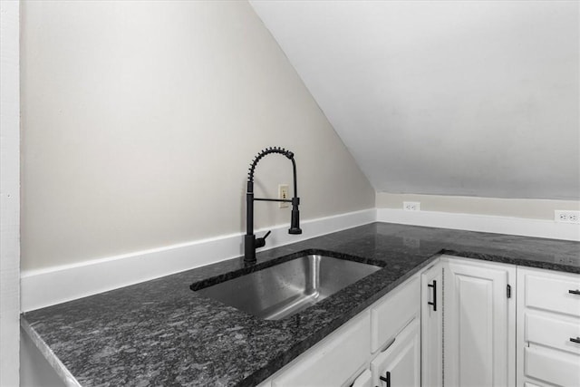 366 Pascoag Main St, Burrillville, RI 02859 - kitchen with a sink, white cabinets, and dark stone countertops