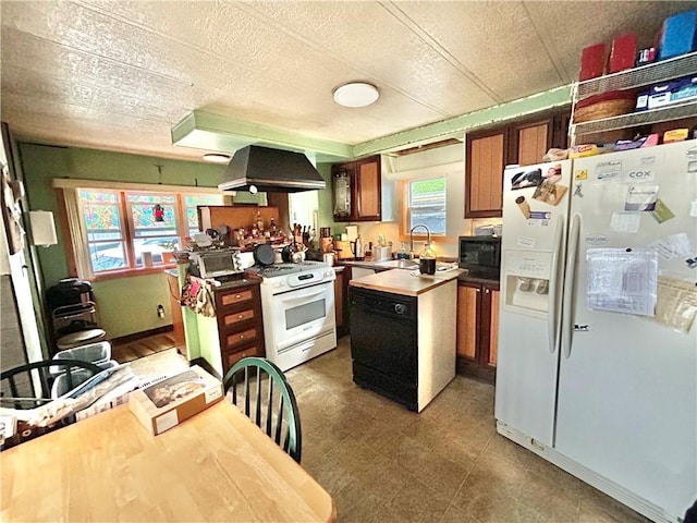 245 Manton St, Pawtucket, RI 02861 - kitchen with black appliances, ventilation hood, brown cabinets, a sink, and light countertops
