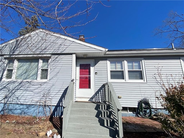 74 Lubec St, Providence, RI 02904 - view of front of property featuring a chimney