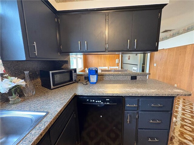 74 Lubec St, Providence, RI 02904 - kitchen with dishwasher, stainless steel microwave, a peninsula, a sink, and light countertops