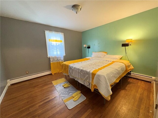 74 Lubec St, Providence, RI 02904 - bedroom featuring baseboard heating, hardwood / wood-style flooring, and baseboards