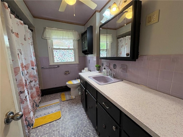74 Lubec St, Providence, RI 02904 - full bath featuring toilet, ceiling fan, tile walls, tile patterned flooring, and vanity