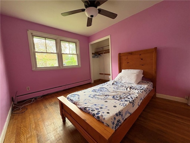 74 Lubec St, Providence, RI 02904 - bedroom with a baseboard heating unit, wood finished floors, a closet, and baseboards