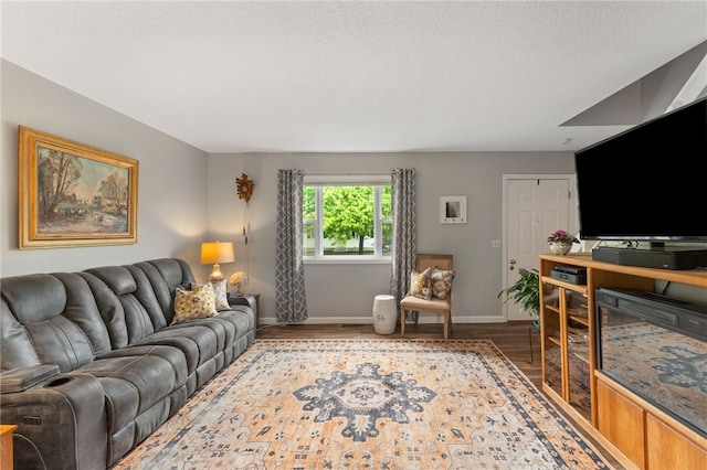 30 Saundra Dr, Westerly, RI 02891 - living area with wood finished floors, baseboards, and a textured ceiling