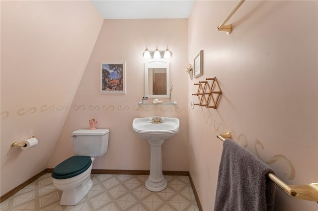 30 Saundra Dr, Westerly, RI 02891 - half bathroom with toilet, baseboards, and tile patterned floors
