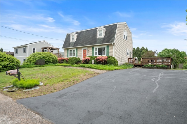 30 Saundra Dr, Westerly, RI 02891 - colonial inspired home featuring roof with shingles, a wooden deck, a gambrel roof, and a front yard