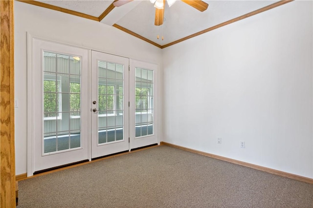 carpeted empty room with crown molding, a ceiling fan, baseboards, french doors, and vaulted ceiling