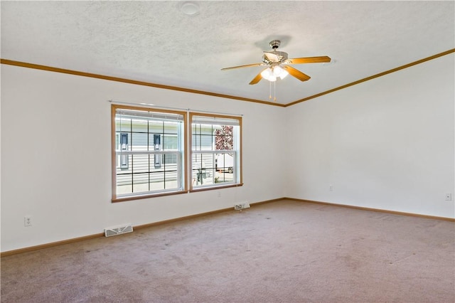 unfurnished room featuring ornamental molding, a ceiling fan, light carpet, and baseboards