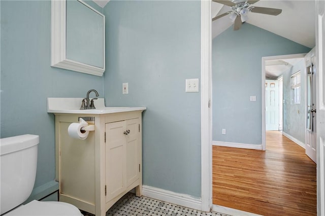 1 Offshore Rd Unit 32, Narragansett, RI 02882 - bathroom featuring toilet, vaulted ceiling, ceiling fan, baseboards, and vanity