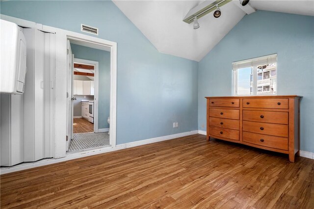 1 Offshore Rd Unit 32, Narragansett, RI 02882 - bedroom with wood finished floors, baseboards, and ensuite bathroom