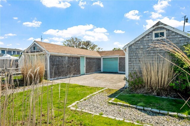1 Offshore Rd Unit 32, Narragansett, RI 02882 - view of outbuilding featuring driveway and an attached garage