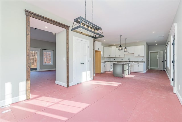 390 Lapham Farm Rd, Burrillville, RI 02859 - kitchen featuring white cabinetry, baseboards, a center island, hanging light fixtures, and recessed lighting