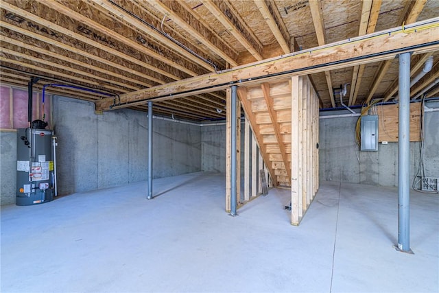 390 Lapham Farm Rd, Burrillville, RI 02859 - unfinished below grade area with gas water heater, stairway, and electric panel