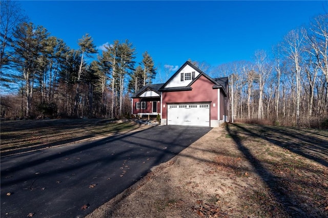 390 Lapham Farm Rd, Burrillville, RI 02859 - view of side of home featuring asphalt driveway and a garage