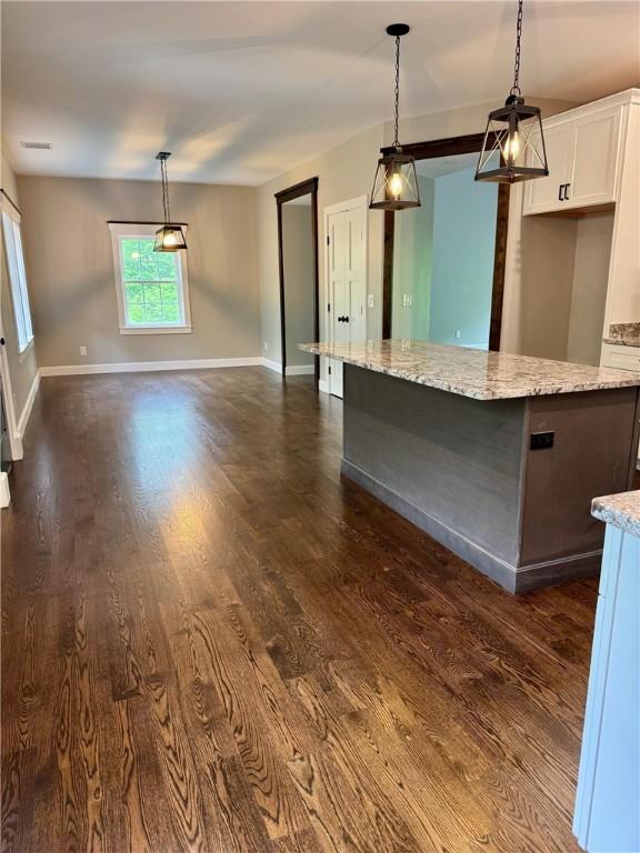 390 Lapham Farm Rd, Burrillville, RI 02859 - kitchen featuring white cabinetry, dark wood-style floors, a kitchen island, pendant lighting, and baseboards