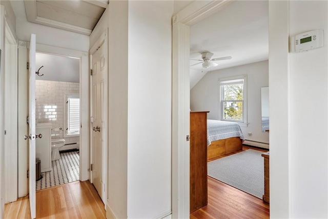 29 Webster St, Newport, RI 02840 - corridor featuring light wood finished floors, a baseboard heating unit, and lofted ceiling