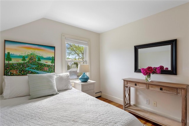 29 Webster St, Newport, RI 02840 - bedroom featuring a baseboard radiator, wood finished floors, baseboards, and vaulted ceiling