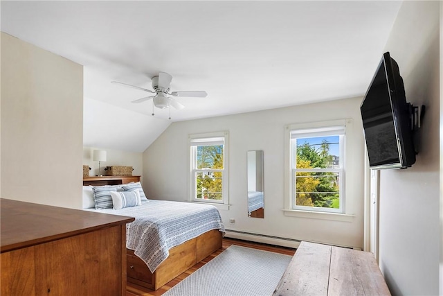 29 Webster St, Newport, RI 02840 - bedroom with a baseboard heating unit, wood finished floors, a ceiling fan, and vaulted ceiling