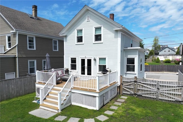29 Webster St, Newport, RI 02840 - rear view of house with a chimney, a wooden deck, french doors, an outdoor hangout area, and a gate
