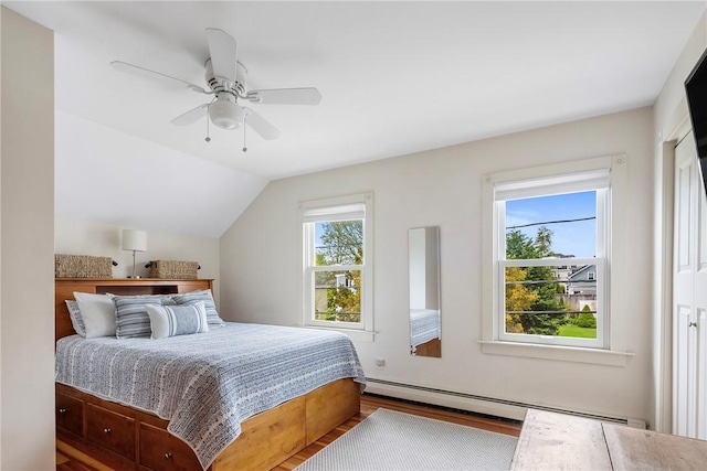 29 Webster St, Newport, RI 02840 - bedroom featuring a baseboard radiator, wood finished floors, vaulted ceiling, and ceiling fan
