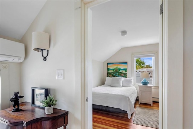 29 Webster St, Newport, RI 02840 - bedroom with an AC wall unit, lofted ceiling, wood finished floors, and baseboard heating