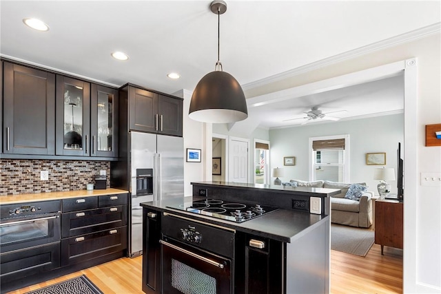 29 Webster St, Newport, RI 02840 - kitchen featuring black appliances, open floor plan, light wood-style floors, recessed lighting, and backsplash