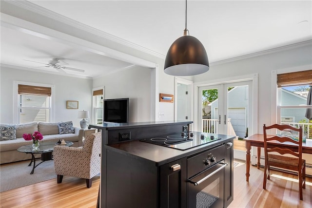 29 Webster St, Newport, RI 02840 - kitchen featuring dark countertops, french doors, black electric stovetop, open floor plan, and crown molding