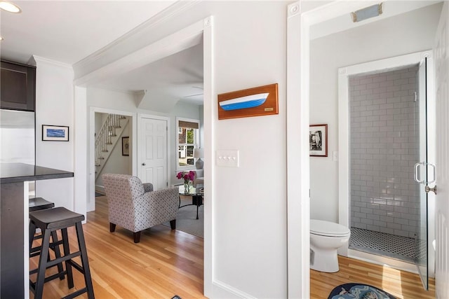 29 Webster St, Newport, RI 02840 - interior space with wood finished floors, crown molding, toilet, a stall shower, and recessed lighting