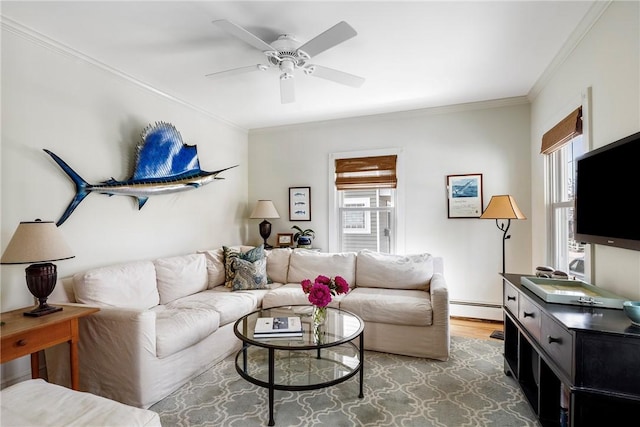 29 Webster St, Newport, RI 02840 - living area featuring baseboard heating, ornamental molding, ceiling fan, and wood finished floors