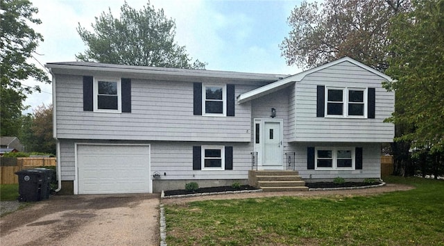 8 Centennial St, Coventry, RI 02816 - raised ranch featuring concrete driveway, an attached garage, and entry steps