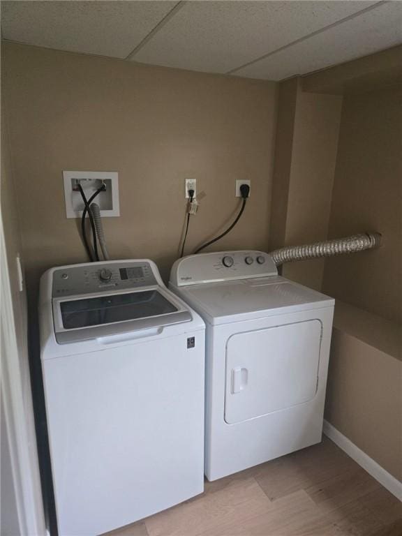 8 Centennial St, Coventry, RI 02816 - clothes washing area featuring independent washer and dryer, light wood-style floors, and baseboards