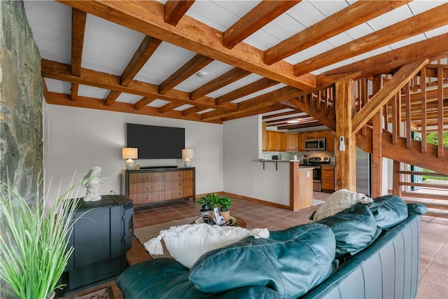 445 Plain Rd, West Greenwich, RI 02817 - living room featuring beamed ceiling, light tile patterned flooring, and baseboards
