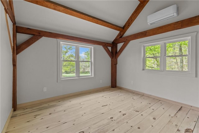 445 Plain Rd, West Greenwich, RI 02817 - additional living space featuring a wall mounted AC, plenty of natural light, and wood finished floors