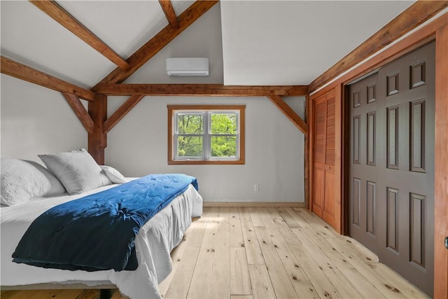 445 Plain Rd, West Greenwich, RI 02817 - bedroom featuring light wood-style flooring, a wall unit AC, a closet, and baseboards