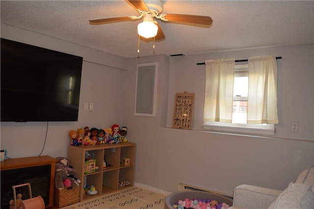 1 Watson Dr, Richmond, RI 02832 - living area featuring a baseboard heating unit, a ceiling fan, and baseboards