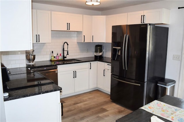1 Watson Dr, Richmond, RI 02832 - kitchen featuring black refrigerator with ice dispenser, a sink, decorative backsplash, white cabinetry, and light wood finished floors
