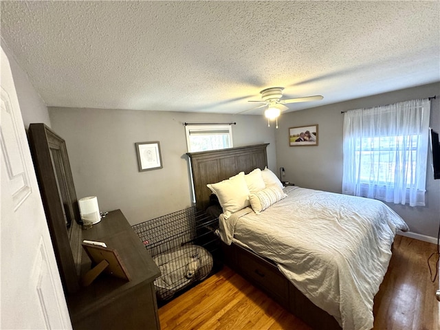 1 Watson Dr, Richmond, RI 02832 - bedroom with wood finished floors, a textured ceiling, and a ceiling fan