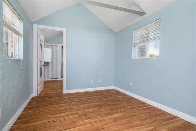 1 Offshore Rd, Narragansett, RI 02882 - unfurnished bedroom with vaulted ceiling, wood finished floors, and baseboards