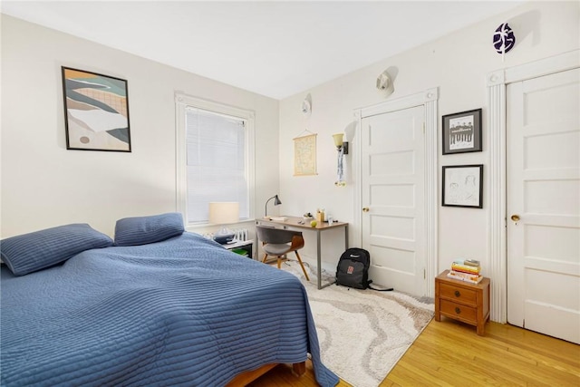 bedroom with light wood-style flooring