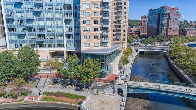 view of apartment building / complex with a water view