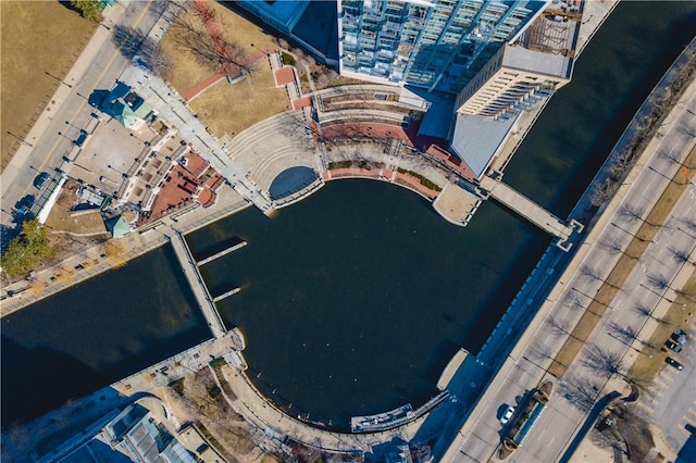 aerial view of property and surrounding area featuring a nearby body of water