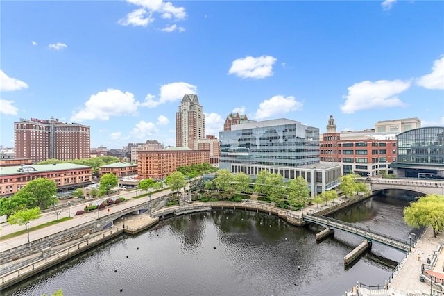 view of urban area with a notable bridge and a nearby body of water