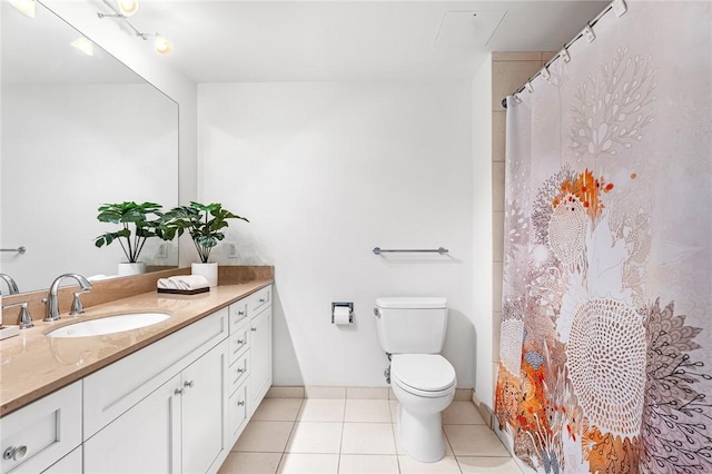 bathroom featuring vanity, toilet, tile patterned floors, and a shower with shower curtain