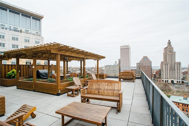 view of patio with a pergola and a city view