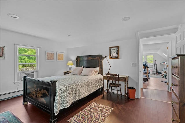 8001 Post Rd, North Kingstown, RI 02852 - bedroom featuring baseboard heating, wood finished floors, vaulted ceiling, recessed lighting, and cooling unit