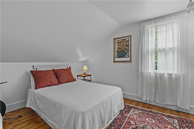 8001 Post Rd, North Kingstown, RI 02852 - bedroom featuring lofted ceiling, hardwood / wood-style floors, and baseboards
