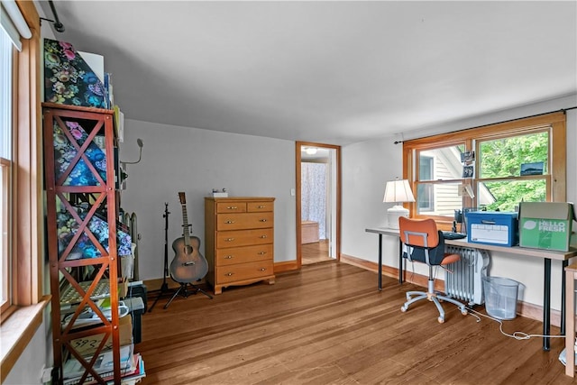 8001 Post Rd, North Kingstown, RI 02852 - office space featuring wood finished floors, radiator heating unit, and baseboards