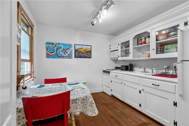 8001 Post Rd, North Kingstown, RI 02852 - dining space with dark wood-type flooring and baseboards